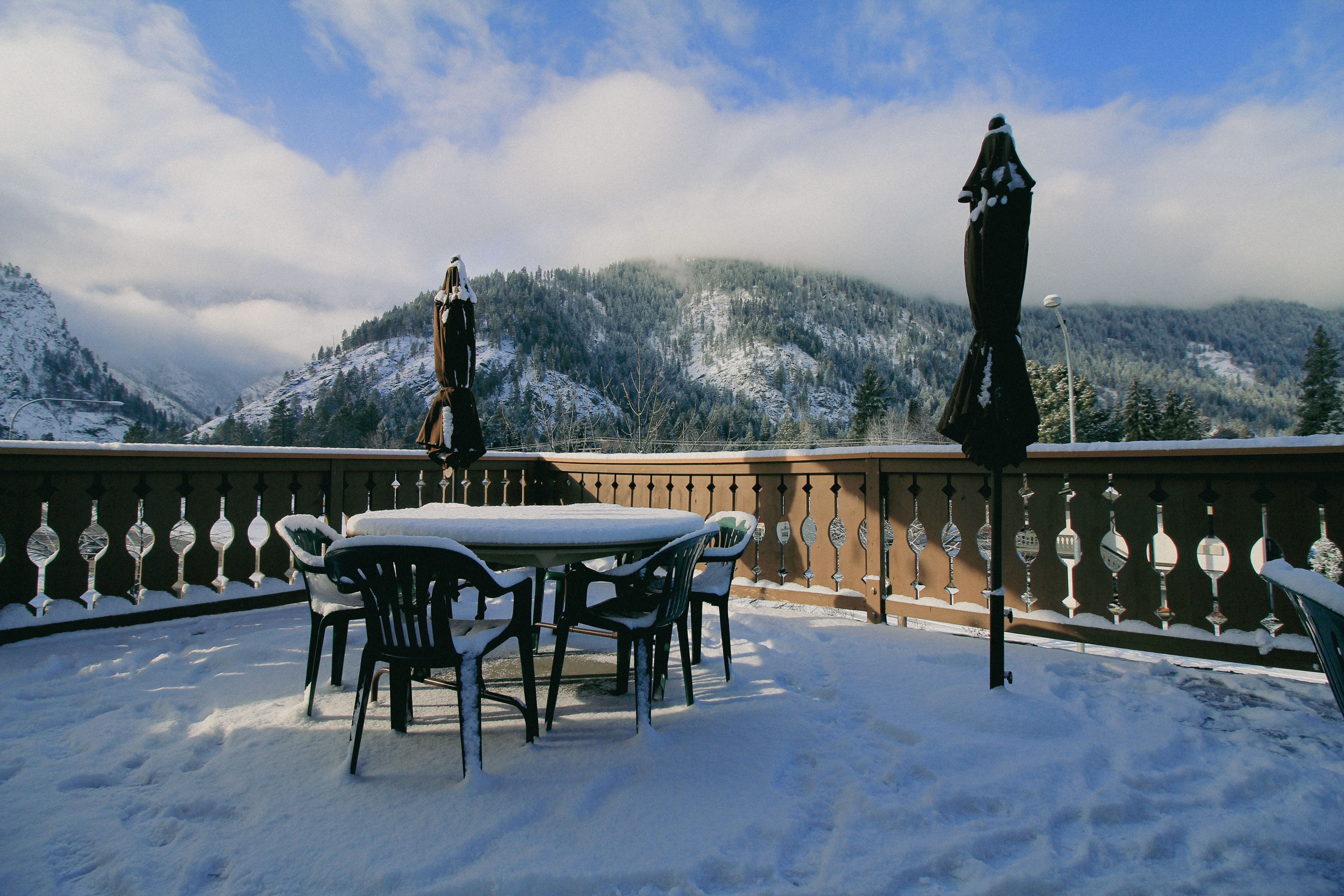 Snow-covered patio demonstrating weatherproof outdoor design in the mountains